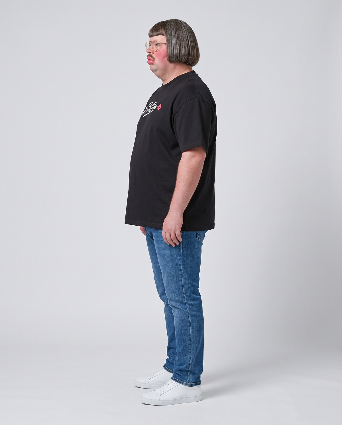 Sir Don wearing the Signature Tee - side